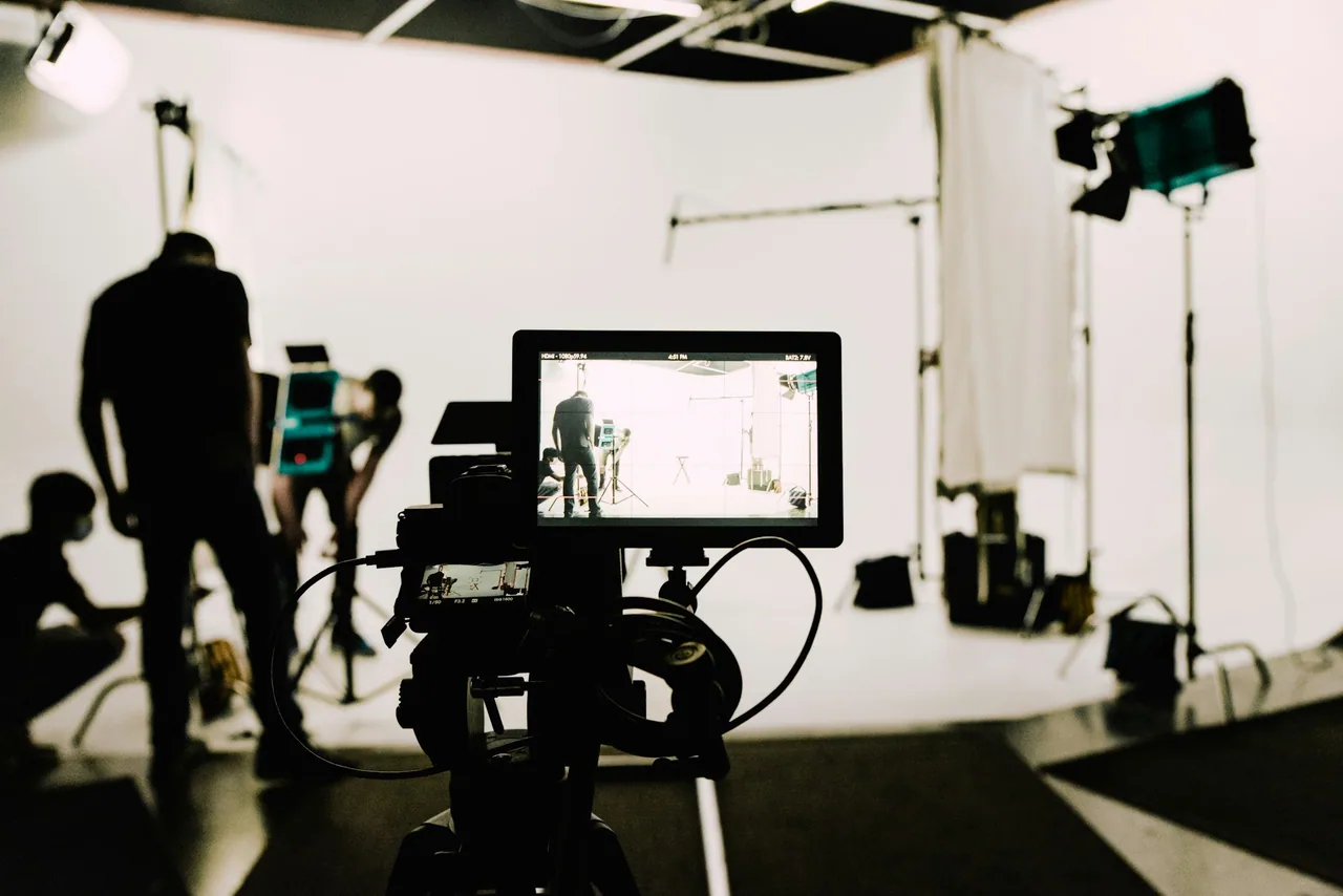 Camera and lighting equipment on a video production set